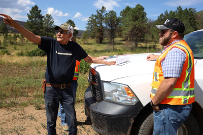 Tito Naranjo shows the USDA around his land