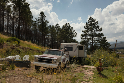 Sam Arthur in front of burned land on his property
